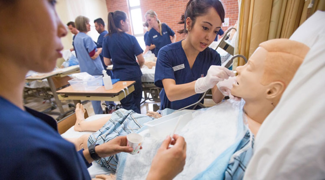 Student Nursing working practicing with a dummy